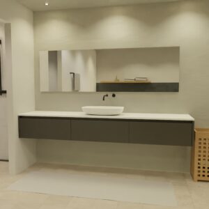 Maatwerk design wastafel onderkast, gemaakt van Zwart melamine of gespoten mdf met een blad van solid surface en 1 waskom van Solid Surface. Het front te openen d.m.v. Greeplijst boven